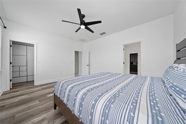 2591 Seagirt Way, Clermont, FL 34711 - bedroom featuring wood finished floors, baseboards, and ceiling fan