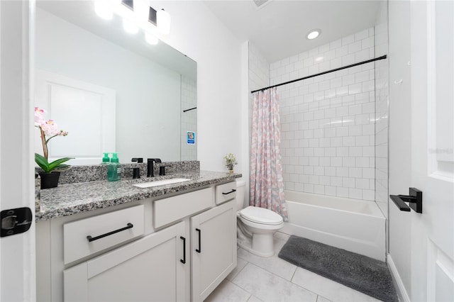 2591 Seagirt Way, Clermont, FL 34711 - bathroom featuring toilet, tile patterned floors, vanity, and shower / bath combo with shower curtain