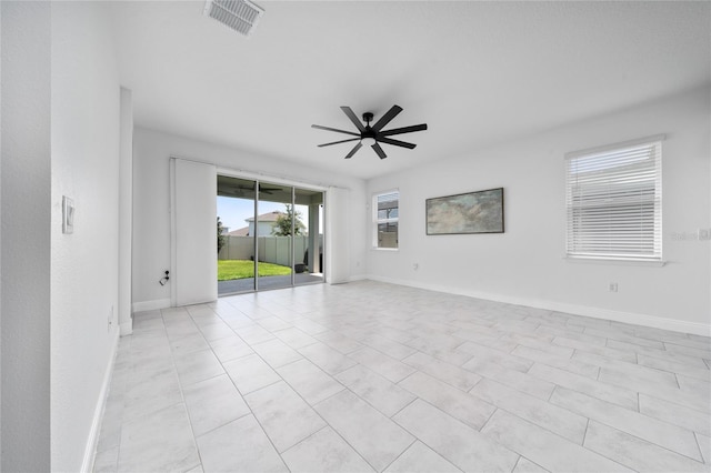 2591 Seagirt Way, Clermont, FL 34711 - spare room featuring a ceiling fan and baseboards