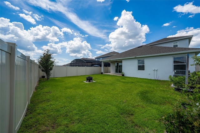 2591 Seagirt Way, Clermont, FL 34711 - fenced backyard with a fire pit