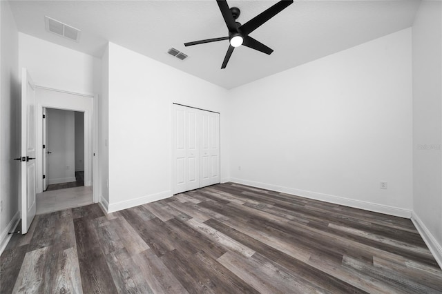 2591 Seagirt Way, Clermont, FL 34711 - unfurnished bedroom featuring dark wood finished floors, a closet, and ceiling fan
