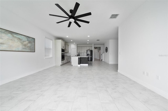 2591 Seagirt Way, Clermont, FL 34711 - unfurnished living room featuring a ceiling fan and recessed lighting