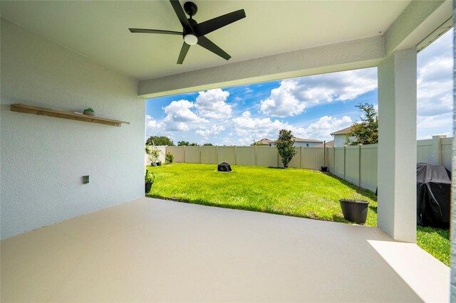 2591 Seagirt Way, Clermont, FL 34711 - fenced backyard with a patio and ceiling fan