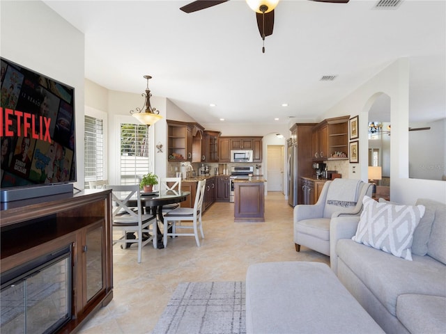 7580 Colony Palm Dr, Boynton Beach, FL 33436 - living room featuring ceiling fan, arched walkways, and recessed lighting