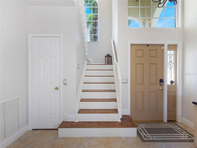7580 Colony Palm Dr, Boynton Beach, FL 33436 - foyer featuring stairs and baseboards