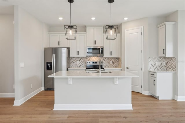 16460 Silver Brook Way, Winter Garden, FL 34787 - kitchen with stainless steel appliances, a sink, tasteful backsplash, light countertops, and recessed lighting