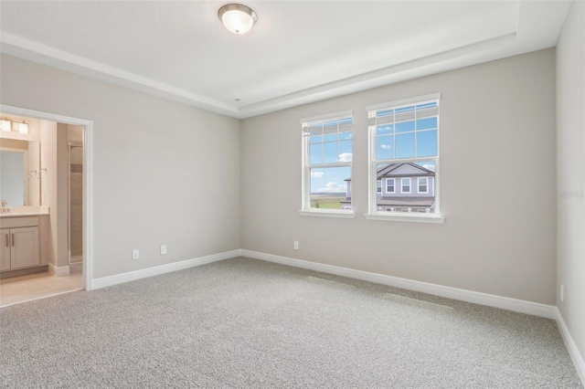 16460 Silver Brook Way, Winter Garden, FL 34787 - unfurnished bedroom featuring light colored carpet, baseboards, and connected bathroom
