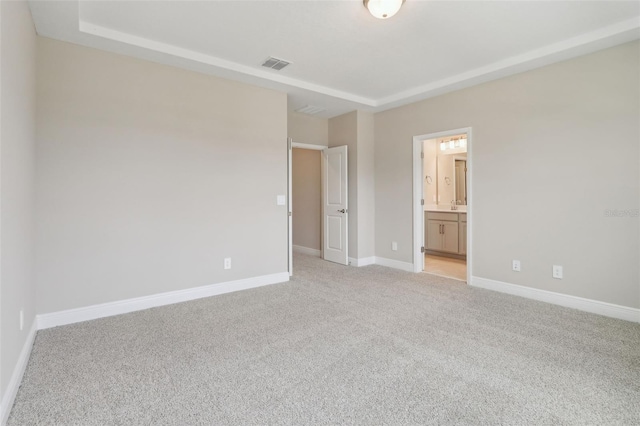 16460 Silver Brook Way, Winter Garden, FL 34787 - unfurnished bedroom with light carpet, baseboards, and connected bathroom
