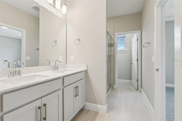 16460 Silver Brook Way, Winter Garden, FL 34787 - full bathroom featuring double vanity, a shower stall, and baseboards