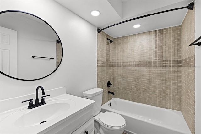 bathroom with toilet,  shower combination, recessed lighting, and vanity