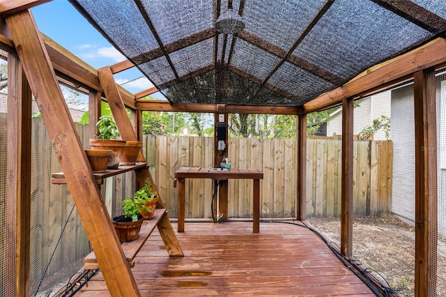 unfurnished sunroom featuring lofted ceiling
