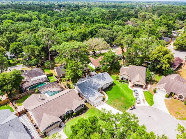 aerial view of residential area with a forest