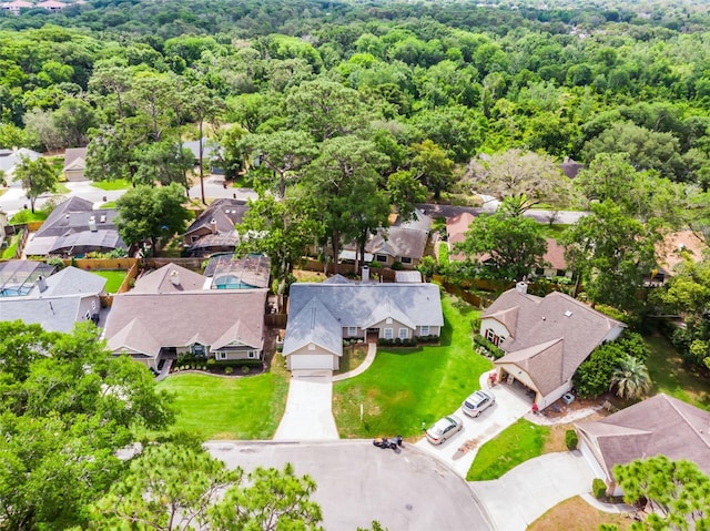 aerial perspective of suburban area featuring a forest
