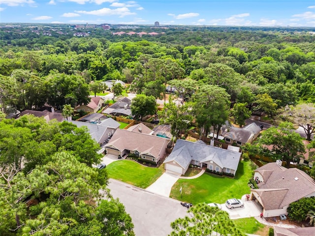 aerial view of residential area with a forest