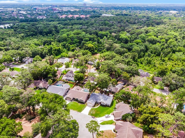 aerial view of residential area with a forest