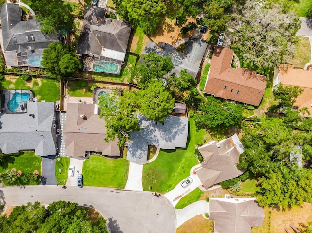 aerial perspective of suburban area featuring a pool area