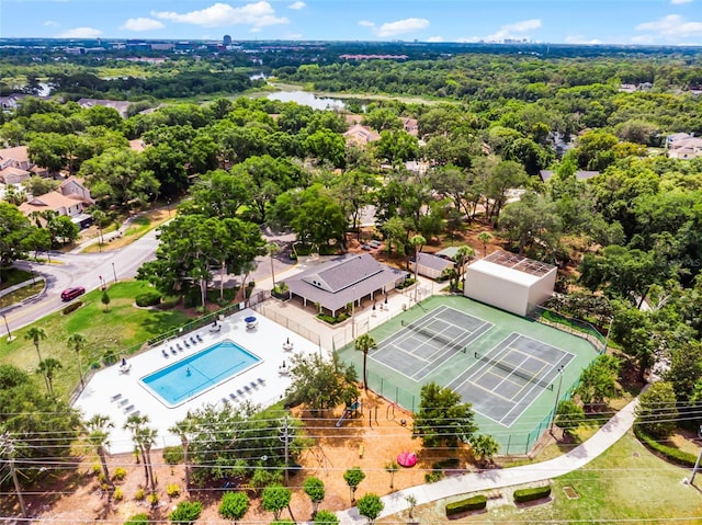 bird's eye view of a pool area and a nearby body of water
