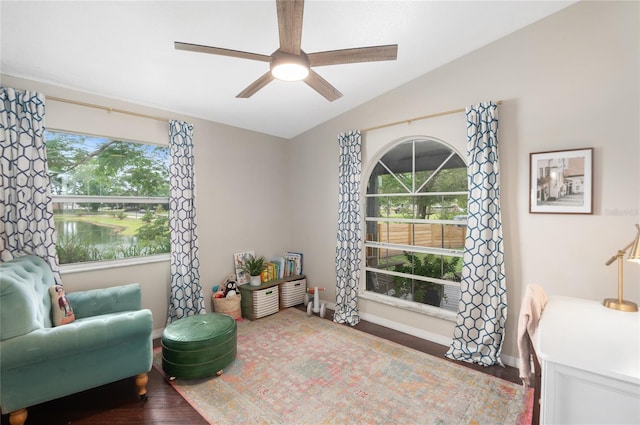 sitting room featuring healthy amount of natural light, ceiling fan, wood finished floors, and lofted ceiling