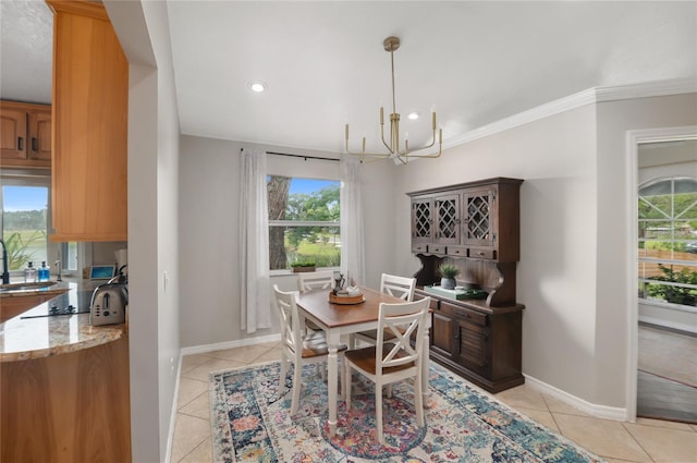 dining area with a chandelier, light tile patterned floors, baseboards, recessed lighting, and crown molding