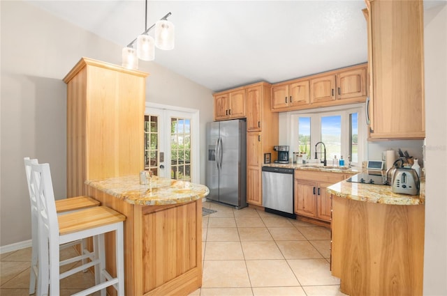 kitchen featuring stainless steel appliances, a sink, light stone countertops, light tile patterned flooring, and french doors