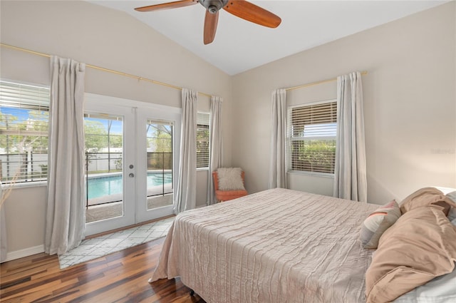 bedroom featuring lofted ceiling, french doors, access to exterior, wood finished floors, and a ceiling fan