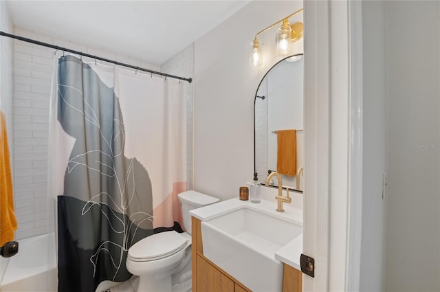 bathroom with vanity, toilet, and shower / bath combo with shower curtain