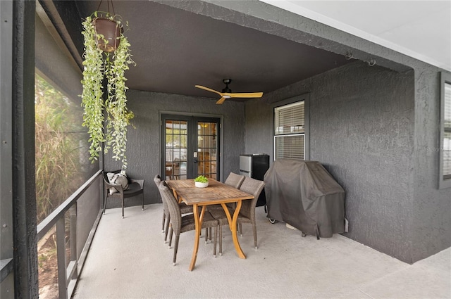 view of patio with french doors, a ceiling fan, outdoor dining space, and grilling area