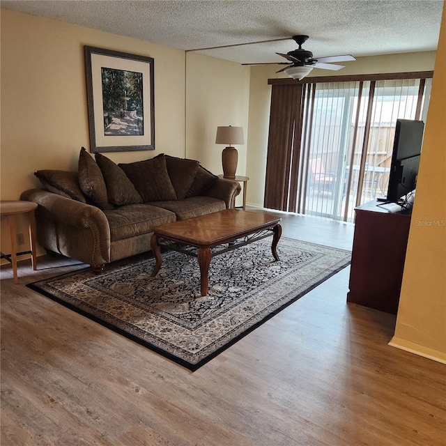 434 Windmeadows St Unit 434, Altamonte Springs, FL 32701 - living room with ceiling fan, wood finished floors, and a textured ceiling