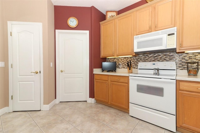 4201 Old Trafford Way, Orlando, FL 32810 - kitchen with white appliances, backsplash, light countertops, light tile patterned floors, and baseboards