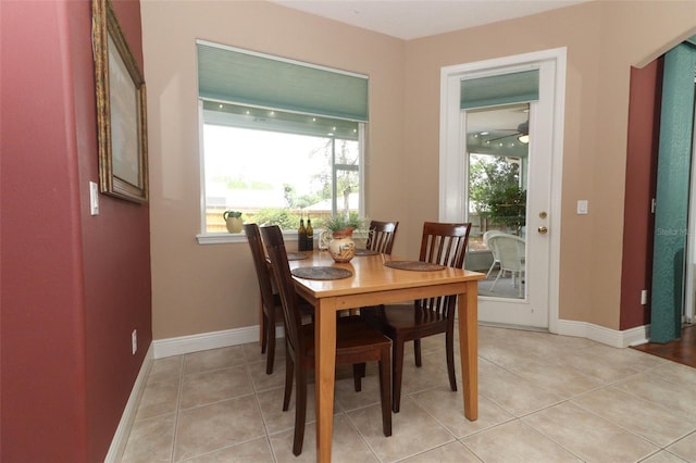 4201 Old Trafford Way, Orlando, FL 32810 - dining room featuring baseboards and light tile patterned flooring