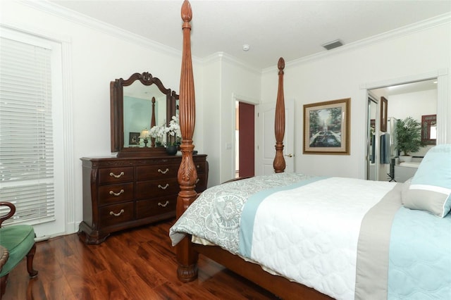 4201 Old Trafford Way, Orlando, FL 32810 - bedroom featuring dark wood-style flooring and ornamental molding