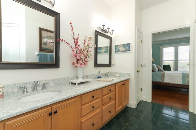 4201 Old Trafford Way, Orlando, FL 32810 - ensuite bathroom featuring tile patterned floors, double vanity, and ornamental molding