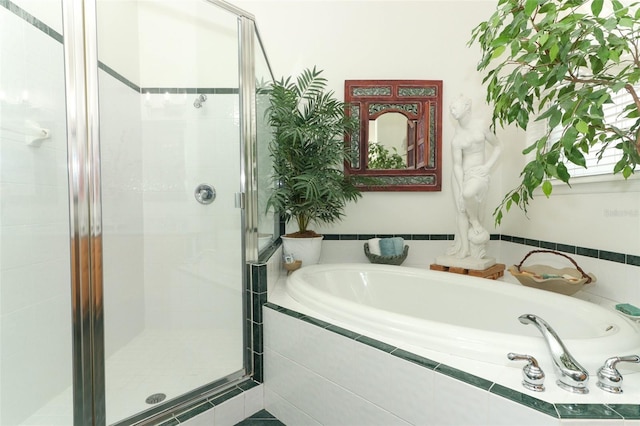 4201 Old Trafford Way, Orlando, FL 32810 - bathroom featuring a stall shower and a bath