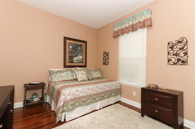 4201 Old Trafford Way, Orlando, FL 32810 - bedroom featuring baseboards and wood finished floors