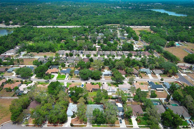 4201 Old Trafford Way, Orlando, FL 32810 - aerial overview of property's location featuring a heavily wooded area and nearby suburban area