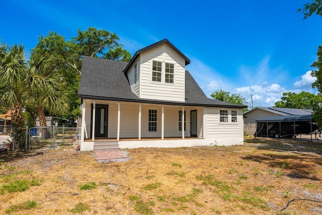 712 Maryland Ave, Saint Cloud, FL 34769 - back of property featuring fence, roof with shingles, a porch, and a gate