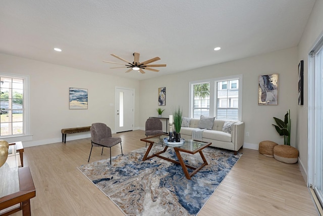 712 Maryland Ave, Saint Cloud, FL 34769 - living area featuring light wood-type flooring, a ceiling fan, recessed lighting, and baseboards