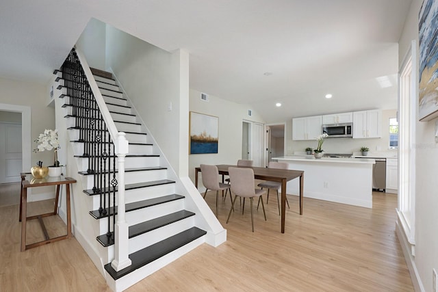 712 Maryland Ave, Saint Cloud, FL 34769 - staircase with wood finished floors, recessed lighting, and baseboards