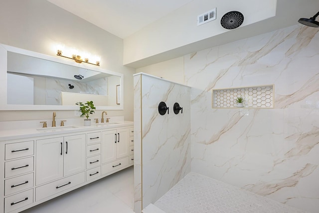 712 Maryland Ave, Saint Cloud, FL 34769 - bathroom featuring marble tiled flooring, a marble finish shower, and double vanity