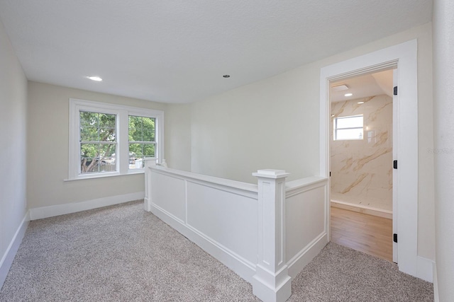 712 Maryland Ave, Saint Cloud, FL 34769 - hall featuring carpet, an upstairs landing, and recessed lighting