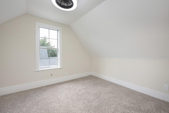 712 Maryland Ave, Saint Cloud, FL 34769 - bonus room featuring vaulted ceiling, carpet flooring, and baseboards