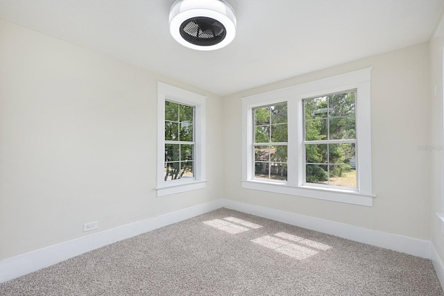 712 Maryland Ave, Saint Cloud, FL 34769 - unfurnished room featuring healthy amount of natural light, carpet flooring, and baseboards