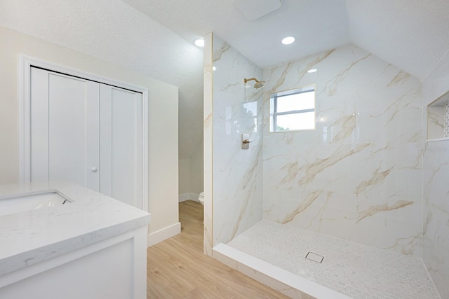 712 Maryland Ave, Saint Cloud, FL 34769 - bathroom featuring a marble finish shower, wood finished floors, toilet, vanity, and recessed lighting