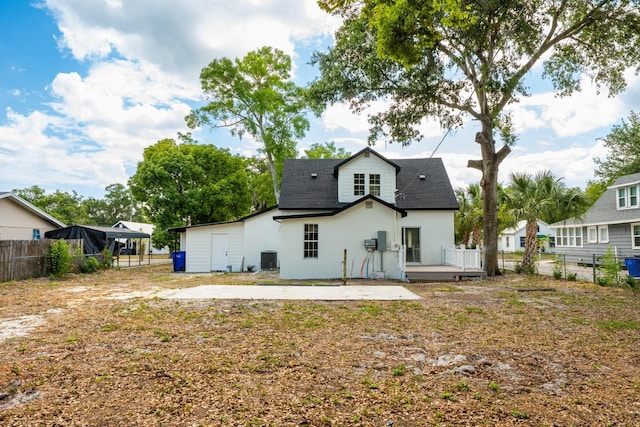 712 Maryland Ave, Saint Cloud, FL 34769 - back of house featuring fence, a deck, stucco siding, and roof with shingles