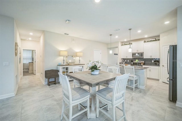 8907 Fallen Oak, Davenport, FL 33897 - dining area featuring recessed lighting and baseboards