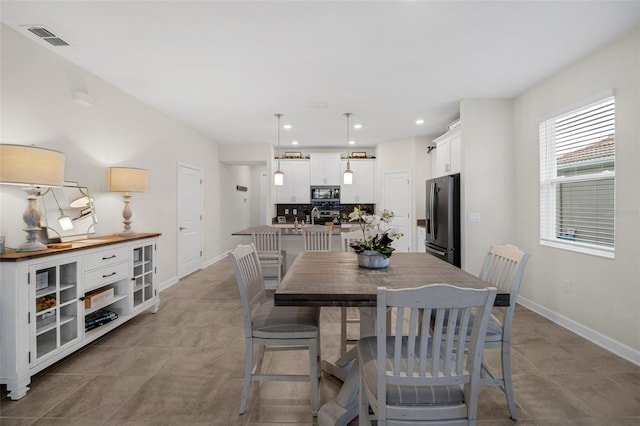 8907 Fallen Oak, Davenport, FL 33897 - dining room featuring baseboards, recessed lighting, and light tile patterned floors