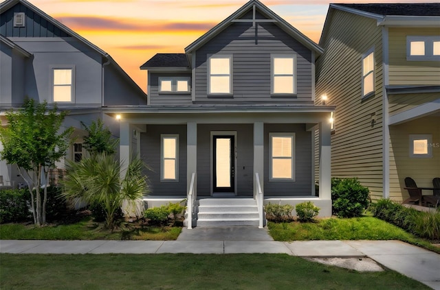 13913 Hahn Ln, Orlando, FL 32827 - view of front of house featuring covered porch and board and batten siding