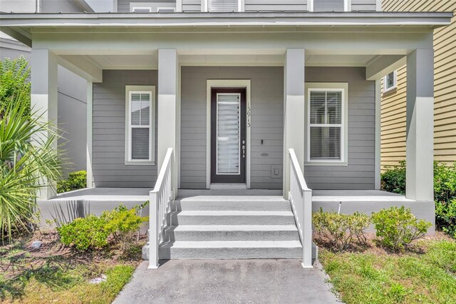 13913 Hahn Ln, Orlando, FL 32827 - view of exterior entry featuring a porch