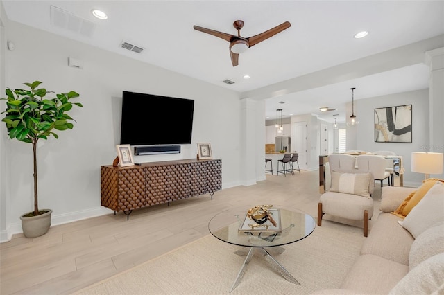 13913 Hahn Ln, Orlando, FL 32827 - living area with ceiling fan, baseboards, recessed lighting, and light wood finished floors
