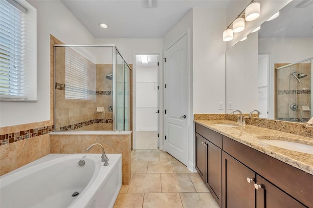 13913 Hahn Ln, Orlando, FL 32827 - bathroom with a shower stall, a garden tub, double vanity, and tile patterned floors